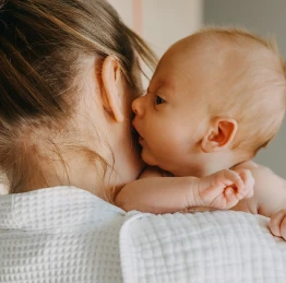 Mom cuddling her baby
