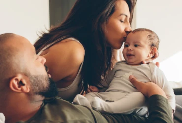 Dad and his baby laughing